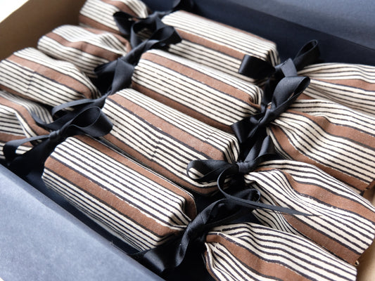 four stripe luxury Christmas crackers in a box 